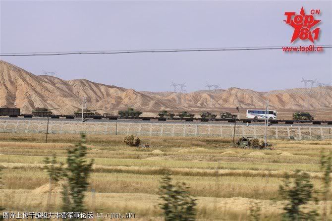 The test group is accompanied by vans and buses most likely for the 